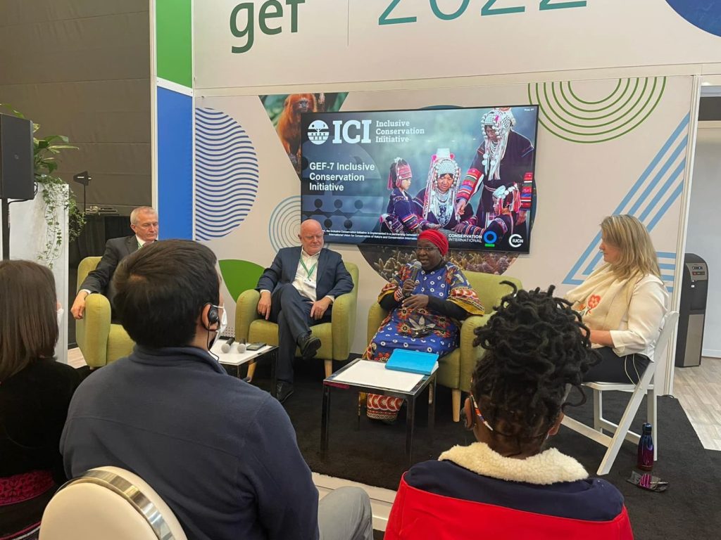 People sitting in a circle for GEF-7 Inclusive Conservation Initiative.